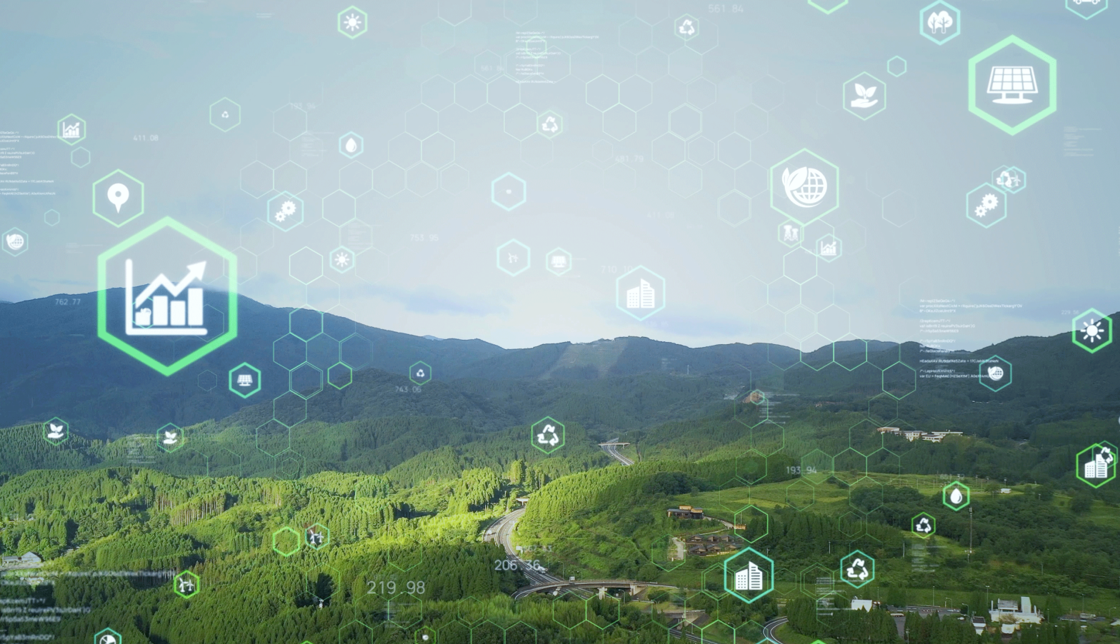 Green countryside with hills in the background. Overlayed are digital icons to represent digital transformation.